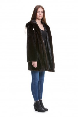 Mink coat fashion in a mink jacket with fur hood